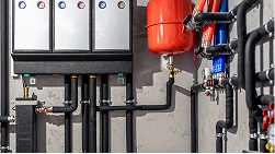 Electrical wires and pipes, representing wiring and plumbing as factors.
