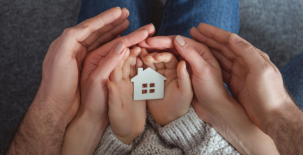 A modern home with a family, symbolizing comprehensive homeowners insurance.